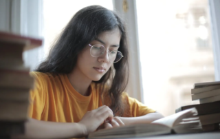 A young woman preparing for her IELTS exam by following the tips on this blog.