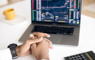 A man observing the predictions that the new corporation tax increase will have on his company.