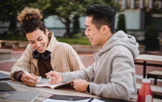 Three students studying the university program they applied for