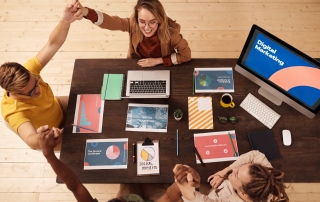 Group of people discussing digital marketing strategy at the table