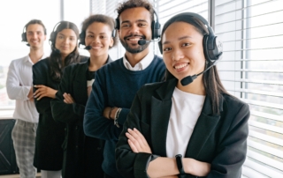 Diverse group of people wearing headphones building customer relationships